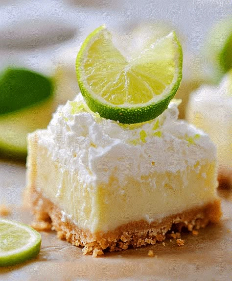 These easy Key Lime Pie Bars are a tangy and creamy dessert, perfect for any occasion with minimal prep and a delightful flavor. Low Cal Key Lime Pie, Food Dolls Key Lime Pie Bars, Easy Key Lime Pie Bars, Key Lime Pie Trifle, Keylime Pie Bars Recipe, Key Lime Pie Bars Recipe, Key Lime Slab Pie, Key Lime Bars Recipe 9x13, Key Lime Bars Easy