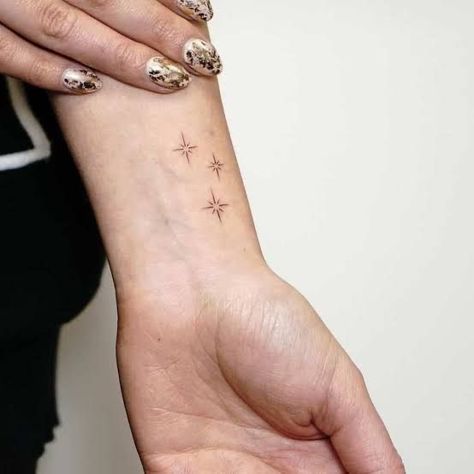 Inner Wrist Star Tattoo, Tiny Stars Tattoo Wrist, Star Tattoo Placement Ideas, 3 Sparkles Tattoo, 3 Small Stars Tattoo, Pretty Star Tattoos, Dream Tattoos Symbol, Stars On Wrist Tattoo, Four Point Star Tattoo