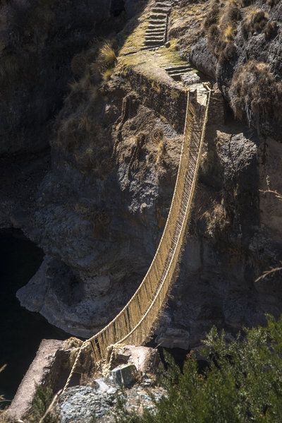 A suspension bridge made of twisted plant fibers stretches high above the Apurimac River in Peru. Local residents, descendants of the Inca, have been making bridges like this for some 500 years. Rope Bridge, Beautiful Bridges, Dangerous Roads, Inca Empire, Cusco Peru, New Groove, Peru Travel, Suspension Bridge, Body Of Water