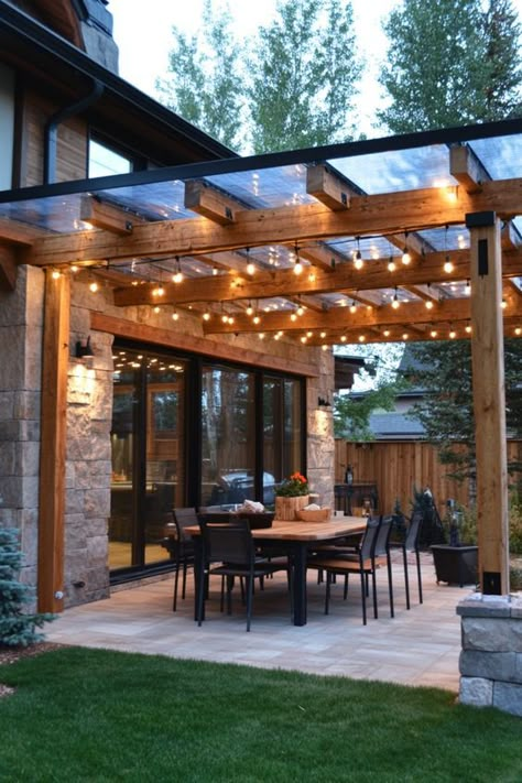 Discover stylish and budget-friendly patio cover ideas to enhance your outdoor space. Explore creative and affordable patio cover ideas for lounging or outdoor dining. Transform your backyard with these amazing patio cover concepts, perfect for any budget. Whether you're looking for patio cover ideas that are chic, cheap, or both, we've got you covered! Pergola Ideas Attached To House Deck, Cover Deck Ideas On A Budget, Deck With Roof Covered Patios, Backyard Covered Patio Designs Layout, Small Covered Back Porch, Adding Covered Patio To Back Of House, Covered Pergola Patio Attached To House, Backyard Awning Ideas Covered Patios, Covered Patio Ideas On A Budget