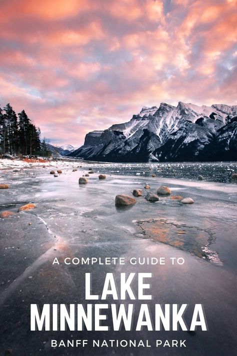 A sunset at Lake Minnnewanka that has been frozen over in winter with the mountains towering in the background. Minnewanka Lake, Banff Trip, Banff Elopement, Jasper Park, Rocky Mountaineer, Forever Winter, Oh Canada, Nancy Drew, Places To Be