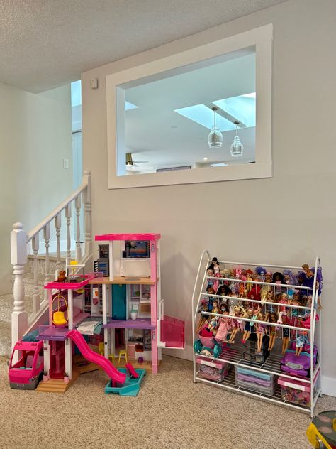 Ingenius solution for storing all those barbie dolla and accessories! Barbie Playset Storage, Playroom Barbie Organization, Playroom Barbie Area, Storage For Barbie Stuff, Organizing Barbie Accessories, Barbie Car Storage Ideas, Barbie Area Playroom, Barbie Organizer Ideas, Barbie Themed Playroom