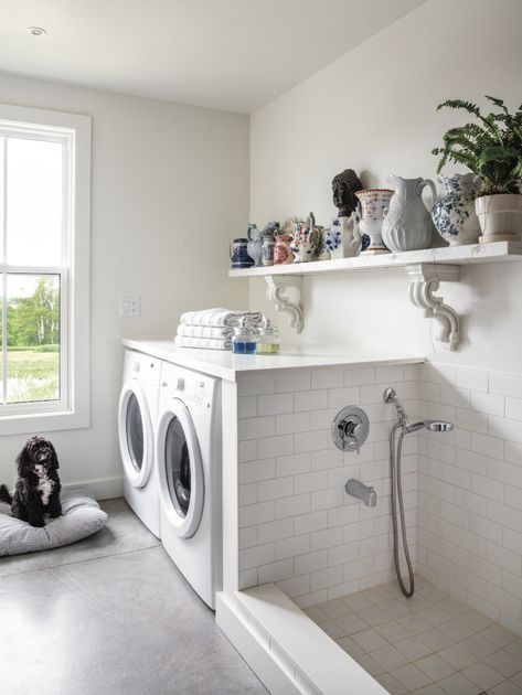 Editor Sara Martin's house on the mountain in Ravenna, Ontario is a true countryside escape! With concrete, tons of light and antiques, and tons of bright white details. Check out the laundry room with white subway tile, vintage pottery and dog bath shower area. Dog Bath Area In Laundry Room, Small Utility Room With Dog Wash, Dog Wash Area In Laundry Room, Laundry Shower Room, Laundry With Dog Space, Small Laundry Room Ideas With Dog Wash, Doggie Bath In Laundry Room, Dog Bath Tub In Laundry Room, Dog Bathing Area