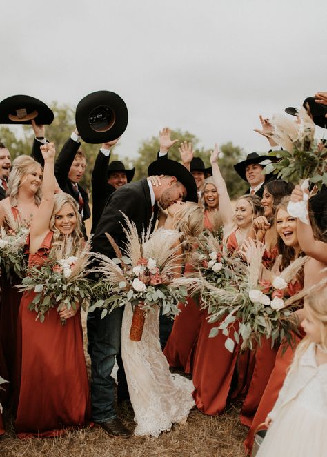 Western boho wedding party photo inspo - cowboy groomsmen and terracotta bridesmaid dresses from Azazie Wedding Party Photos Country, Cowboy Bridesmaid Dresses, Western Boho Wedding Bridesmaid Dress, Bridesmaid Dresses Country Wedding, Western Bridesmaids Dresses, Western Wedding Party Photos, Country Wedding Party Attire, Western Bridal Party Photos, Vintage Western Wedding Dress