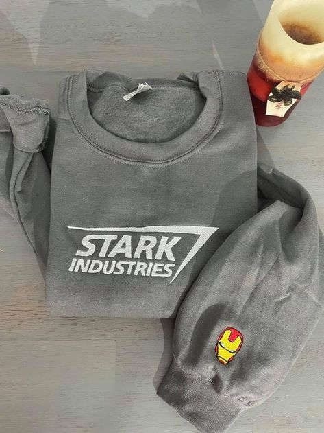 Stark Industries Embroidered Sweatshirt Stark Industries Embroidered Sweatshirt is best Embroidery Clothing for you or gift for friend, family. Shopping more hoodie at here , . Are you looking for a stylish and comfortable way to show off your love of Stark Industries? Look no further than the Stark Industries Embroidered Sweatshirt from DreamArtCanada. This high-quality sweatshirt is made from soft, breathable cotton fabric and features an intricate embroidery design that will make you stan... Marvel Merch, Stark Industries, Marvel Clothes, Design Sweatshirt, Oversized Crewneck, Embroidered Crewneck, Shirt Embroidery, Embroidered Clothes, Embroidered Sweatshirt