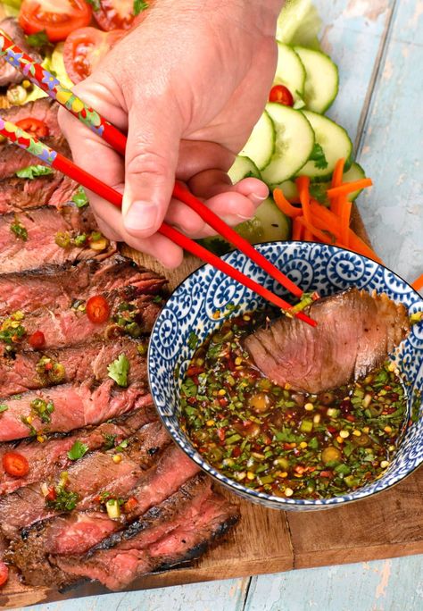 Using chopsticks to dip a piece of steak into the dipping sauce. Crying Tiger Beef Recipe, Tiger Cry Beef Recipe, Asian Potluck Dishes, Crying Tiger Sauce, Crying Tiger Steak, Crying Tiger Beef, Authentic Thai Recipes, Thai Recipes Authentic, Asian Dipping Sauce