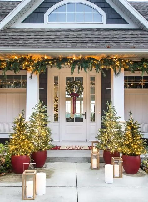 Front porch christmas decorations red planters with trees and wreath on a white front door Exterior Christmas Decorations, Exterior Christmas, Porch Columns, Winter Porch, Christmas Front Doors, Christmas Front Porch, Christmas Porch Decor, Front Porch Christmas, Front Porch Decorating