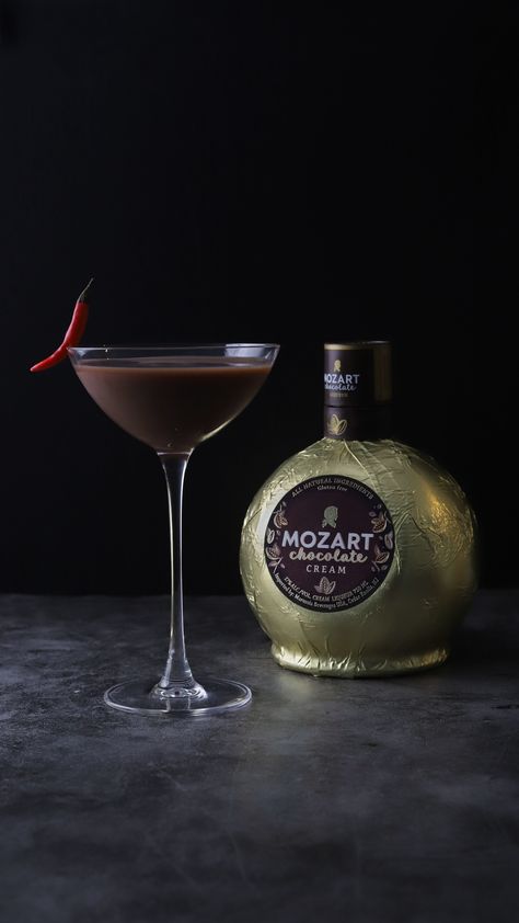 1.5 oz #MozartChocolateCreamLiqueur 1 oz crème de cacao 1 oz vodka 1/8 tsp cinnamon 1 pinch cayenne Shake with ice & fine-strain into a coupe. Garnish with a chili pepper. Shop Mozart Chocolate Cream Liqueur at mozartchocolateliqueur.thirstie.com 🛒⁠ Mozart Chocolate Cream Liqueur is also available at @specs1962, @abcfinewinespirits, & @thebarreltap 🛍 📸 & 🍸: @garnish_girl Must be 21+. Enjoy responsibly. 17% ABV. Imported by @marussiabeveragesusa #CelebrateWithMozart #MozartMoment Mozart Liqueur, Mozart Chocolate, Chocolate Martinis, Liqueur Recipes, Chocolate Martini, Liqueurs Recipes, Mexican Chocolate, Chocolate Liqueur, Cream Liqueur