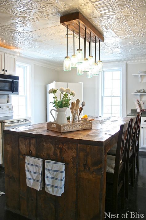 farmhouse kitchen @INDI Interiors - Nest of Bliss Tin Ceiling Kitchen, Kitchen Ceiling Tile, White Tin Ceiling, Kitchen Credenza, Trendy Farmhouse Kitchen, Exterior Light Fixtures, Tuscan Design, Farmhouse Kitchen Island, Farmhouse Light Fixtures