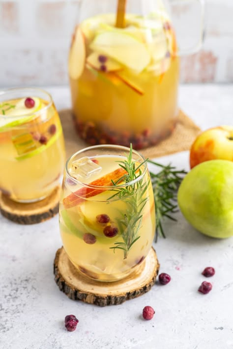 This white wine sangria is light, refreshing and effervescent, with flavors of vanilla, apples, and cranberries. #recipe from thissillygirlskitchen.com #sangria #whitewinesangria #wintersangria #holidaysangria #cranberry #apple #cocktail Winter Sangria Recipes White, White Cranberry Sangria, Best White Sangria Recipe, Winter Sangria Recipes, White Wine Cocktail, Cocktails For Christmas, White Wine Sangria Recipe, Cranberry Sangria, White Sangria Recipe