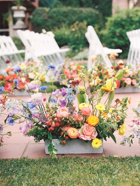 40+ Wildflower Wedding Decor Ideas | Junebug Weddings How To Make Aisle Flowers, Wildflower Aisle Decor, Wildflower Wedding Aisle Decorations, Colorful Wedding Ceremony Decor, Wildflower Aisle Wedding, Wildflower Arch Wedding, Wild Flower Themed Wedding, Diy Aisle Decorations Wedding, Wildflower Wedding Aisle