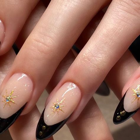 Christie Rhae Gibson on Instagram: "Classic black French with gold chrome ❤️ #nails #chiconails #nailart #chicostate #blackfrenchnails #almond #goldchrome #starburst" Black Colourful Nails, Black Gold Tip Nails, Black And Gold Nails Stars, Black French Tip Nails With Jewels, Short Black And Gold Nails Ideas, Black Nails Gold Tips, Black Tip Nails With Design, Black And Gold Nails Coffin, Black French With Gold