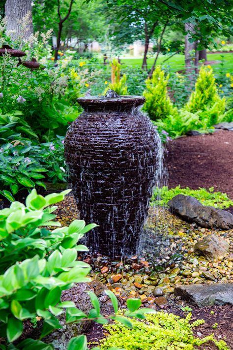 Recirculating urn fountain is easy to install with a complete kit. #fountain #gardening #gardenfountain Urn Water Features Fountain Ideas, Rock Garden With Fountain, Landscape Around Fountain, Fountain Landscaping Ideas, Rock Fountain Ideas, Urn Water Feature, Urn Fountain, Outdoor Fountains, Urn Water Fountain