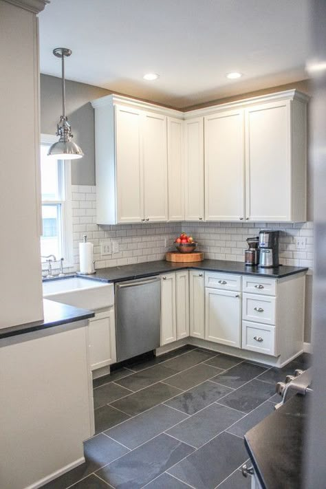 Modern Farmhouse Kitchen. Gray tile floors, white cabinets. Would use a different backsplash with white cabinets - Cool neutral color scheme Gray Flooring, Blue Kitchen Designs, Grey Floor Tiles, Kitchen Floors, Herringbone Backsplash, Best Modern House Design, Farmhouse Kitchen Cabinets, Cabin Kitchens, Casa Vintage