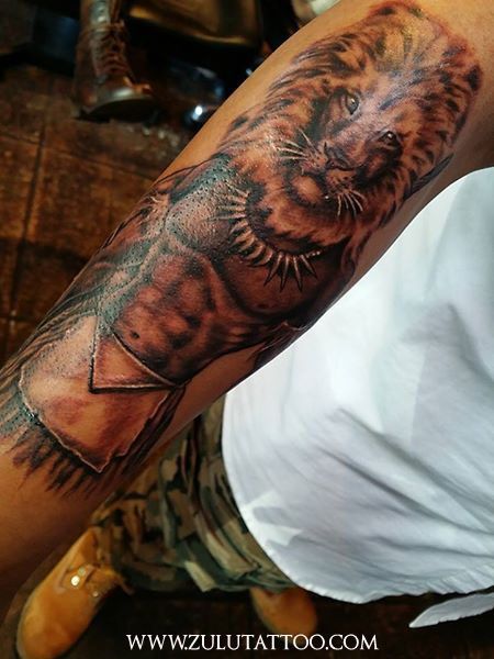 Lion of the Tribe of Judah tattoo by Zulu at Zulu Tattoo LA. Zulu Tattoo Ideas, Tribe Of Judah Tattoo, Zulu Warrior Tattoo, Zulu Tattoo, Judah Tattoo, African Warrior Tattoos, African Sleeve Tattoo, Fine Tattoos, Leg Sleeve Ideas