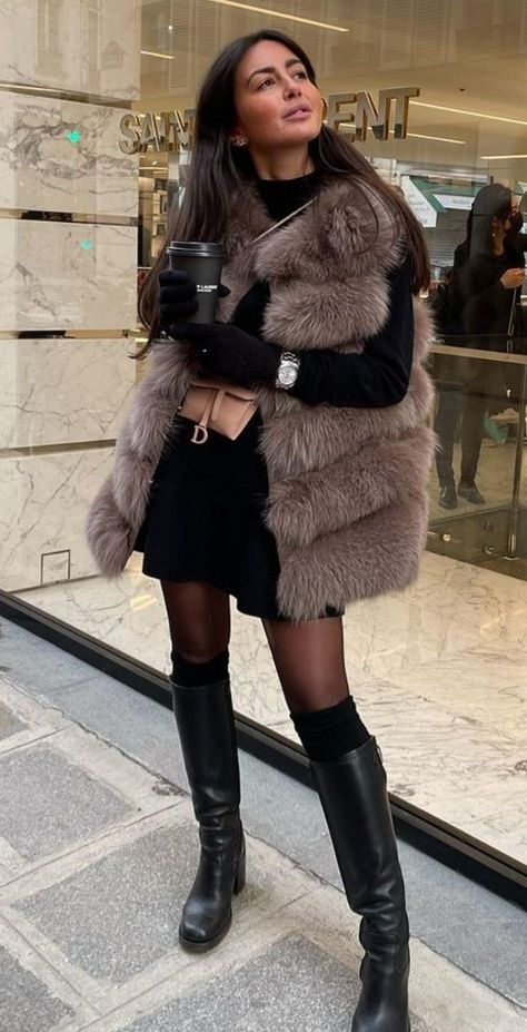 Winter Gilet Outfit, Fur Vest Outfit 2024, Styling Fur Vest, Grey Fur Vest Outfit, How To Style A Fur Vest, Sleeveless Fur Coat Outfit, Long Fur Vest Outfit, Black Faux Fur Vest Outfit, Fuzzy Vest Outfits For Women