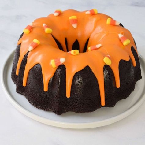 Spice up Halloween with this chocolate bundt cake with candy corn glaze | GMA Bundt Cake Decorations, Mini Bunt Cake, Spice Bundt Cake, Snack Halloween, Corn Cake, Chocolate Bundt, Baking Stuff, Spiced Chocolate, Torte Cupcake