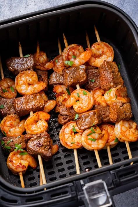 Steak and Shrimp kabobs in air fryer basket sprinkle with fresh cilantro. Steak And Shrimp Kabobs, Cook Shrimp, Shrimp Kabobs, Steak Sandwiches, Air Fryer Ideas, Air Fryer Meals, Steak And Shrimp, Shrimp Skewers, Air Fryer Oven Recipes