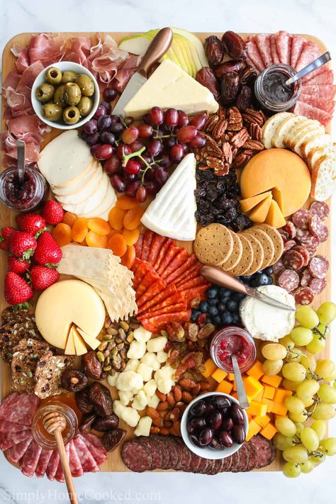 Ultimate Charcuterie Board with an assortment of meats, cheeses, fruit, nuts, bread, crackers, olives, jams, and honey. Cheese Board Ideas, Charcuterie Board Meats, Whole Wheat Crackers, Dessert Inspiration, Picnic Photoshoot, Charcuterie Ideas, Bread Crackers, Charcuterie Platter, Charcuterie Board Ideas