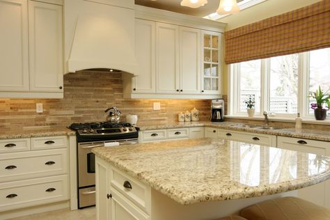 Giallo Ornamental Granite for Warm & Elegant Kitchen Design | Aqua Kitchen & Bath Design Center Kitchen Cabinets And Backsplash, Beige Kitchen Cabinets, Backsplash Kitchen White Cabinets, Beige Backsplash, Granite Island, Outdoor Kitchen Countertops, Elegant Kitchen Design, Cabinets White, Paint Kitchen