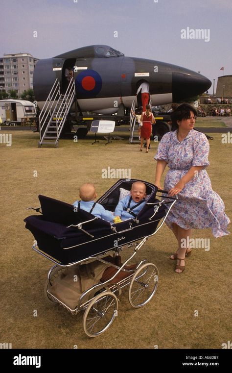 Download this stock image: Twin Silver Cross double pram 1980s UK. Mother and twins at an RAF demonstration Bournmouth Dorset, South coast England circa 1985 HOMER SYKES - AE6DB7 from Alamy's library of millions of high resolution stock photos, illustrations and vectors. Mother And Twins, Prams Uk, Silver Cross Prams, Double Prams, Twin Pram, Kingdom Woman, Women Health Care, Twin Boys, Cool Baby