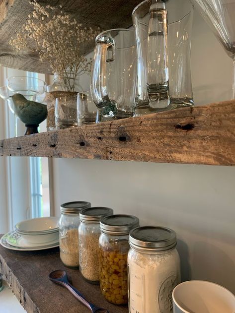 The easiest way to give your home that farmhouse feeling is with rustic shelves! Our reclaimed wood shelves would love to be part of the conversation in your kitchen! Wood Floating Shelves Kitchen, Wood Kitchen Shelves, Shelving Laundry Room, Rustic Kitchen Shelves, Farmhouse Kitchen Shelves, Wooden Shelves Kitchen, Wood Shelves Kitchen, Kitchen Shelf Styling, Kitchen Floating Shelves