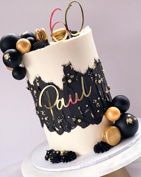 Black and gold textured cake for a 60th birthday 🖤 With gold dusted macarons, chocolate dipped polystyrene balls and gold leaf detail… | Instagram White Black And Gold Cake Ideas For Men, Retirement Cake Black And Gold, Elegant Black And Gold Cake, Gold Black Cake Birthday, Black And Gold Food Ideas, Black And Gold Cakes For Men, White Gold Black Cake, Black And Gold Cake For Men Birthday, White Gold And Black Cake