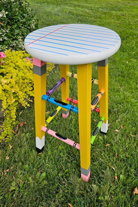 With pencils, crayons, and paper in mind, I transformed this ordinary stool into a craft supply masterpiece for my classroom! 🍎 Classroom Stools Painted, Diy Teacher Stool, Painted Classroom Chair, Teacher Stools Painted Diy, Pencil Stool, Painted Teacher Stool, Teacher Stool, Teacher Stools, Teacher Chair