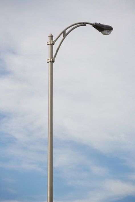 A leaning pole is usually indicative of soil erosion or shift, and the angle of the lean grows progressively acute as the soil around the pole erodes or shifts further. Lamp Post Night, Nature Alphabet, Street Lamp Post, Street Light Design, Red Storm, Downtown Buildings, Outdoor Lamp Posts, Lamps Aesthetic, Graphic Shirt Design