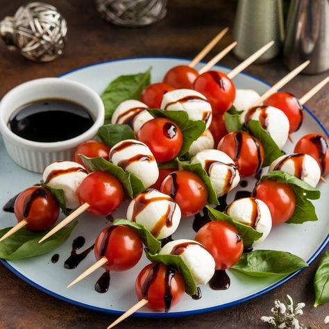 Caprese Salad Skewers Ingredients: - Cherry tomatoes - Fresh mozzarella balls - Fresh basil leaves - Balsamic glaze Method: 1. Thread cherry tomatoes, mozzarella balls, and basil leaves onto skewers. 2. Drizzle with balsamic glaze. Serving: Arrange on a platter with extra glaze for dipping. #caprese #salad #skewers #recipes #foodforfoodies #healthyfood #healthyfood Tomato With Mozzarella And Basil, Tomato Bocconcini Skewers, Skewers Recipes, Salad Skewers, Caprese Salad Skewers, Mozzarella Balls, Tomatoes Mozzarella, Caprese Skewers, Food Tech