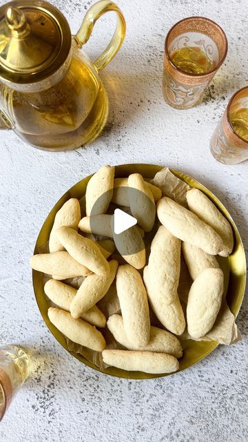 Guila Sandroussy on Instagram: "🇲🇦Moroccan tea cookies recipes are very valuable. Let me explain why.

Most of the OG moroccan bakers are our grandmothers, great-grandmothers. We all know how horrible they all are at giving over recipes, relying mostly on their senses when they bake🤔 

Unfortunately… this generation is slowly leaving us, and so are their recipes. 

One of my life goals is to get as many of these recipes down in writing so that the next generation can enjoy the taste of memories, one recipe at a time 🤍

Moroccan sugar cookies - 2 ways
~ Recipe from my Tata Hèlene❤️

- 3 eggs
- 3/4 cup sugar
- 1/2 cup oil
- 2 tbsp cornstarch
- 1 tbsp (heaping) baking powder
- 2 bags vanilla sugar
- 1 tsp orange blossom water (optional)
- 2 1/4 cup flour 
- Sugar, for dipping

Directions: Moroccan Sweets, Moroccan Sweets Desserts, Traditional Moroccan Desserts, Moroccan Orange Cake, Harira Soup Morocco, Tea Cookies Recipe, Moroccan Cookies, Orange Blossom Water, Tea Cookies