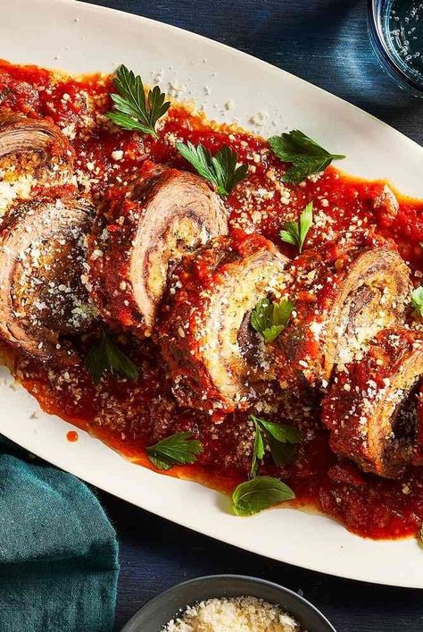 Braciole is rolled meat roulade that has been stuffed with breadcrumbs, cheese, pine nuts, and herbs. This recipe braises the braciole in a homemade tomato sauce until it’s meltingly tender. This is a perfect recipe for a family dinner. #dinnerideas#dinnerrecipes#dinnerdishes#familydinnerideas#supper#supperideas Rolled Meat, Braciole Recipe, Italian Main Dishes, Meat Rolls, Italian Meals, Homemade Tomato Sauce, Italian Foods, Beef And Pork, Italian Dinner