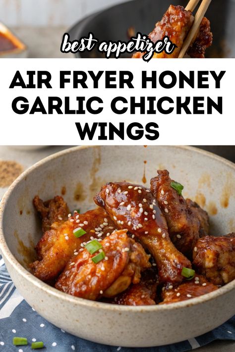 A close-up of a bowl filled with golden and crispy air fryer honey garlic chicken wings, garnished with sesame seeds and chopped green onions. A pair of chopsticks is holding one wing, highlighting the glistening honey garlic sauce. The background features a blurred kitchen setting, creating a cozy and appetizing vibe. Air Fryer Honey Garlic Chicken, Wings Airfryer, Air Fryer Lunch Recipes, Gluten Free Air Fryer Recipes, Air Fryer Lunch, Gluten Free Chicken Tenders, Honey Garlic Wings, Honey Chicken Wings, Air Fryer Chicken Breast