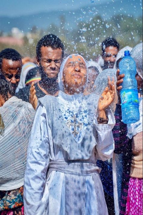 Ethiopian epiphany (Timket) is a colourful festival celebrated all over Ethiopia to commemorate the baptism of Jesus Christ by John the Baptist in the River Jordan. The commemoration starts on the eve of the main festival on 19 January. The eve is known as Ketera, which means blocking the flow of water for the blessing of the celebrants. On the eve of Ketera, people escort their parish church tabot (replicas of the Ark of the Covenant) to Timkete-Bahir (a pool, river or artificial reservoir) Ethiopian Epiphany, The Baptism Of Jesus, River Jordan, Baptism Of Jesus, The Ark Of The Covenant, Bff Matching Outfits, Orthodox Priest, Ark Of The Covenant, Ethiopian Music