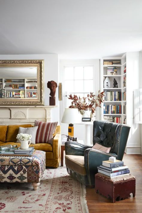 Michael and Andrew transformed this space--formerly a kids' playroom--into a cozy reading room. First, they hired a local carpenter to install built-in shelves on three walls, which was no easy task in the 200-year-old home. Loft Inspiration, Comfortable Furniture, Design Del Prodotto, Family Room Design, Room Remodeling, Farmhouse Living, Cozy Living Rooms, Cheap Home Decor, Cozy Living