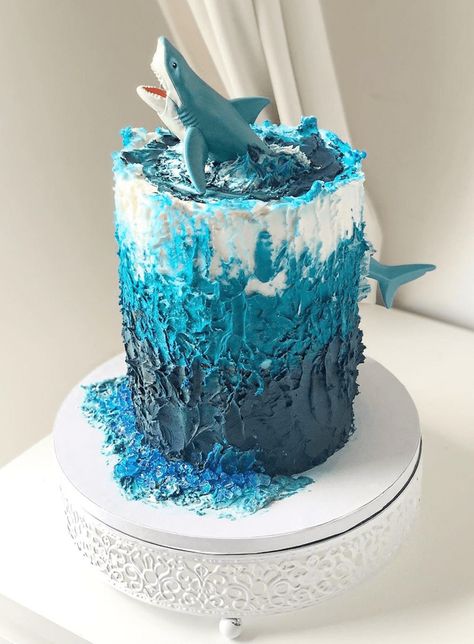 Shark Cake Design Images (Shark Birthday Cake Ideas) Shark Smash Cake, Boys Birthday Cake Ideas, Shark Themed Cakes, Sea Birthday Cake, Shark Birthday Cake, Ocean Birthday Cakes, Shark Birthday Cakes, Ocean Birthday Party, Ocean Cakes