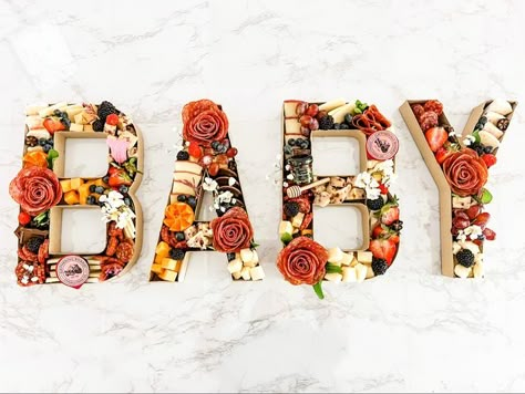 Grazing Table Letters, Charcuterie Board Ideas Letter, Word Charcuterie Board, Fall Baby Shower Charcuterie Board, Letter Shaped Charcuterie Board, Letter Food Tray Ideas, Charcuterie Board Gender Reveal, Baby Letter Charcuterie Board, Baby In Bloom Charcuterie Board