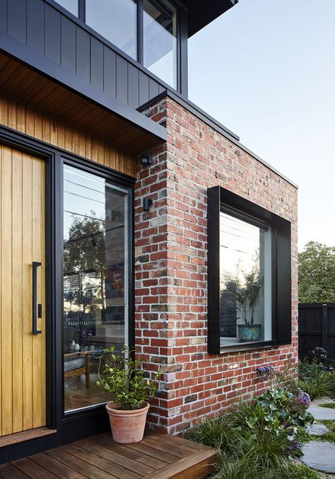 STEEL WINDOW BOX ON ENTRY WINDOW Surrounded by the recycled bricks is a deep steel window box detail that adds depth and shadow to this modern house facade. #Window #Bricks #ModernHouse Renovation Facade, Modern Brick House, Recycled Brick, House Cladding, Casa Country, Red Brick House, Modern House Facades, Brick Exterior House, Brick Facade