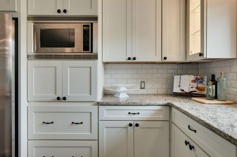 6 Perfect Places to Put the Microwave in Your New Kitchen White Kitchen Bronze Hardware, Painted Wood Cabinets, Microwave Wall Cabinet, Bronze Kitchen Hardware, Easy Kitchen Updates, Drawers Handles, Kitchen Cabinets Knobs And Pulls, 10x10 Kitchen, Distressed Cabinets