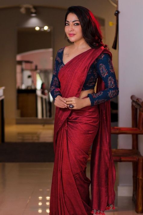 In a maroon color saree, printed dark blue color full sleeve blouse design and jewelry Full Sleeve Blouse Design, Blouse Neck Models, Full Sleeves Blouse Designs, Blue Blouse Designs, Maroon Saree, Full Sleeve Blouse, Saree Blouse Neck Designs, Cutwork Blouse Designs, Modern Saree