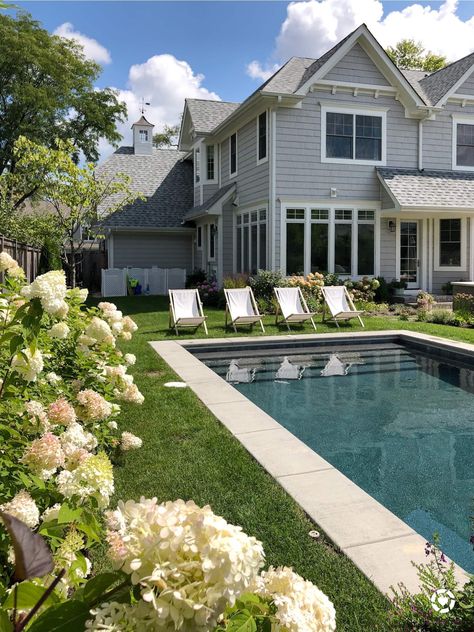 Sleek and simple designs and plenty of space to roam—we’ve rounded up 10 of our favorite Hamptons-inspired swimming pools. #swimmingpools #hamptonsstylepools #poolideas #backyardpools #poollandscaping Hamptons Style Pool, Hampton Pool, Hamptons Pool, Life On Cedar Lane, Hamptons Summer, Pool Landscape Design, Hamptons House, Beautiful Pools, Backyard Pool Designs