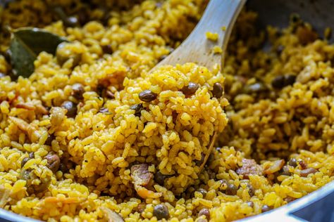 Puerto Rican arroz con gandules | Pigeon pea and rice recipe Rice And Gandules Puerto Rico, Puerto Rican Arroz Con Gandules, Rice And Pigeon Peas Recipe, Cuban Pernil Recipe, Arroz Con Gandules Puerto Rican, Pigeon Peas Recipe, Arroz Con Gandules Recipe, Rice With Pigeon Peas, Rice And Pigeon Peas