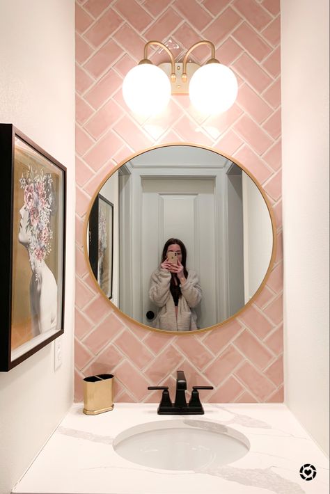 Pink accent tile wall. Adorable half bath vanity area with pops of gold. Sweet style. Pink And Gold Tile Bathroom, Pink Wc Small Bathrooms, Ensuite Bathroom Ideas Pink, Pink Herringbone Tiles Bathroom, Bathroom Ideas Pink And Gold, Small Bathroom Pink Tiles, Toilet Pink Tiles, Pink Wc Ideas, Pink Tiled Bathroom Ideas