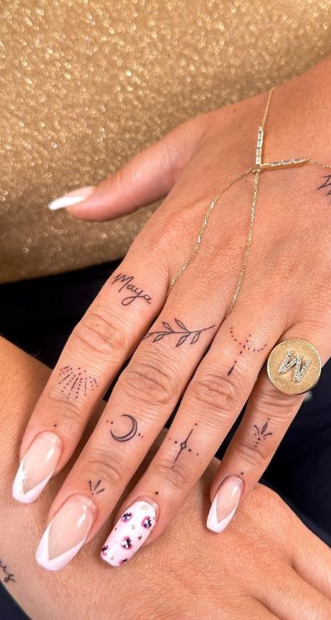 100 Hand Tattoos For Women With Style - Tattoo Me Now Female Hand And Finger Tattoos, Hippy Hand Tattoos For Women, Small Hand Tattoos Words, Finger Tattoos Wrap Around, Tony Hand Tattoos, Tiny Tattoos For Fingers, Hand Jewelry Tattoos For Women, Fine Line Hands Tattoo, Soft Hand Tattoo