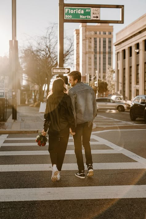 Couples photoshoot in downtown Tampa. They are wearing a leather black jacket, jeans and sneakers for a casual relaxed look with a touch of vintage.