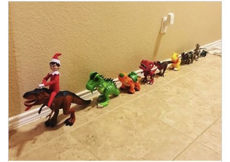 Elf On The Shelf Partner Ideas, Elf On The Shelf Gifts From Santa, Elf On Shelf With Dinosaurs, Santa Elf Ideas, Elf On The Shelf Ideas For Little Boys, Toddler Boy Elf On The Shelf Ideas, Elf With Dinosaurs, Elf On The Shelf Ideas With Toys, Elf On The Shelf Ideas With Dinosaurs