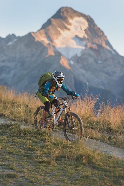 Woman wearing helmet and backpack riding mountain bike downhill singletrack on the alpine backcountry route Female Mountain Bikers, Mountain Bike Aesthetic, Alps Mountains, Mt Bike, Mountain Biking Women, Portrait Of Woman, Bike Aesthetic, Downhill Bike, Instagram Grid