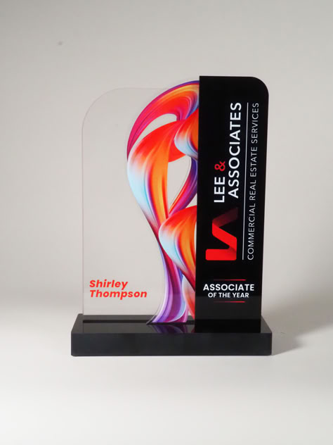 This stunning piece, designed by our talented team member Ray Vibar, showcases a striking blend of clear and black acrylic, illuminated by vibrant color-fused hues. With 15 years of dedication to our company, Ray has crafted an award that embodies both innovation and artistry. Celebrate exceptional achievements with the elegance of the SkyFire Award! Acrylic Trophy Design, Award Plaque Design, Award Trophy Design, Plakat Acrylic, Trophy Display, Acrylic Trophy, Award Design, Award Trophy, Glass Awards