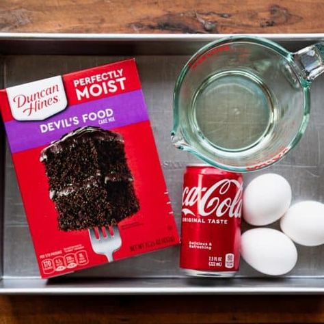 This Coca Cola cake is a classic Southern dessert made easy -- thanks to help from a box of cake mix! A homemade fudgy pecan and Coca Cola frosting coats each decadent slice of the moist and fluffy chocolate cake. Chocolate Box Cake Mix Recipes, Chocolate Coke Cake, Cocoa Cola Cake, Coca Cola Cupcakes, Chocolate Coca Cola Cake, Chocolate Box Cake, Chocolate Cake Mix Recipes, Coke Cake, Fluffy Chocolate Cake