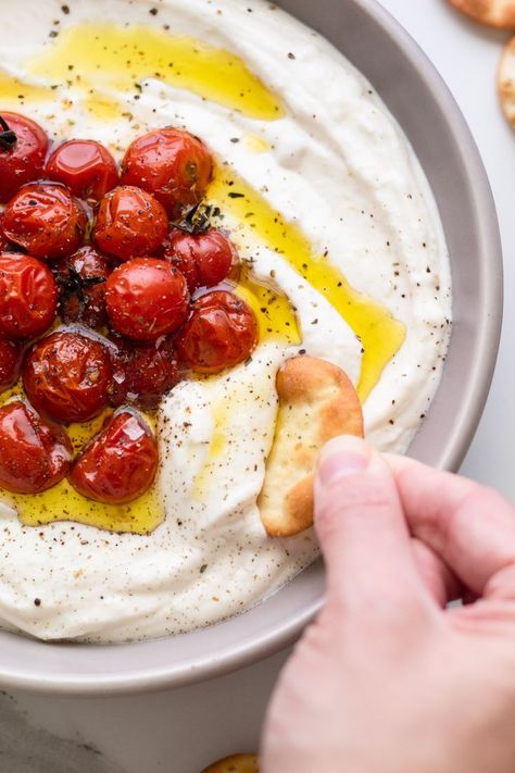 dipping cracker in garnished ricotta dip Whipped Mozzarella Dip With Burst Cherry Tomatoes, Roasted Garlic Whipped Ricotta, Savory Whipped Ricotta, Whipped Ricotta With Roasted Tomatoes, Ricotta And Tomatoes, Cherry Tomato Dip Recipes, Whipped Ricotta And Roasted Tomatoes, Whipped Mozzarella Dip, Ricotta Tomato Recipes